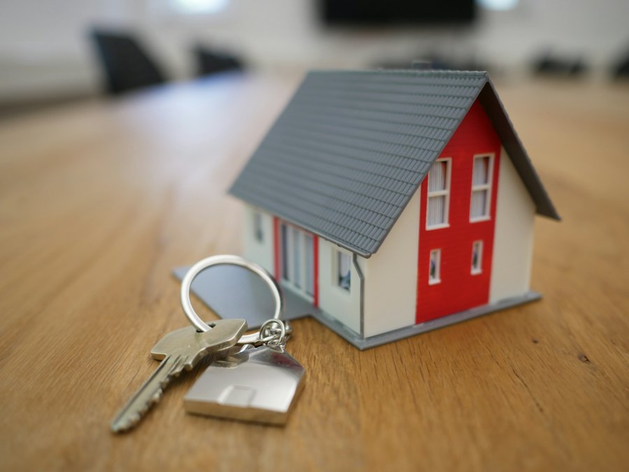 House keys and a small model house on a table