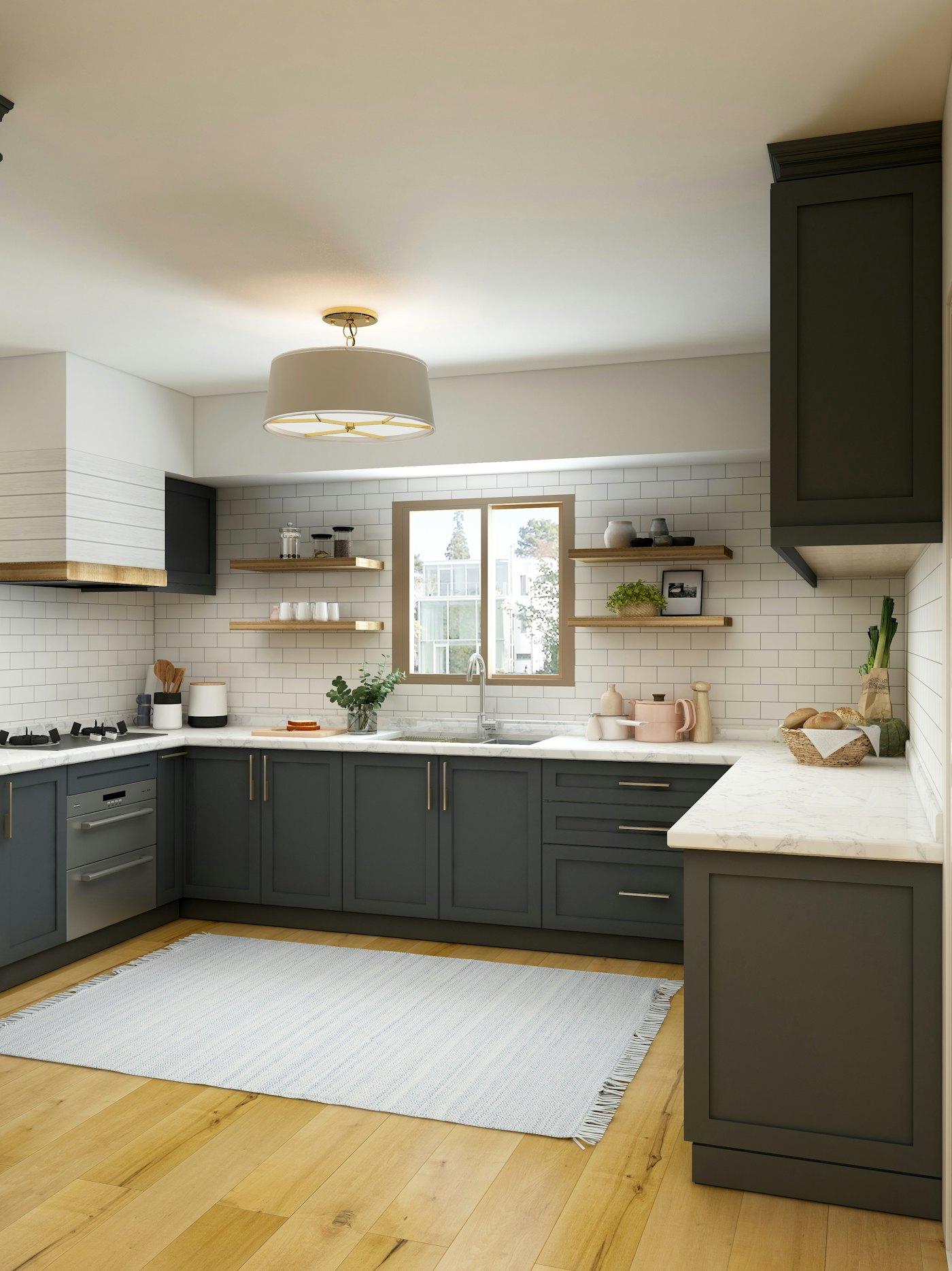 A kitchen with grey units and a white tiled splashback